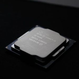 Detailed close-up image of a computer processor chip on a dark background.